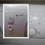 Bouton d'alimentation du lave-linge