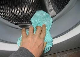 cleaning the rubber band of a washing machine