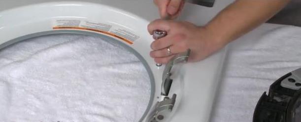 replacing door hinges on a washing machine