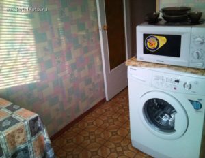 Is it possible to put a microwave on a washing machine?