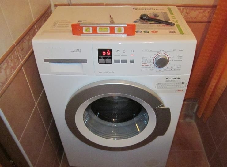 installing a washing machine by level