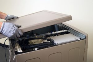 How to remove the cover from an LG washing machine