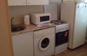 Is it possible to place a washing machine next to the stove?