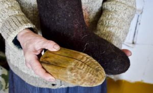 place wooden blocks inside the felt boots