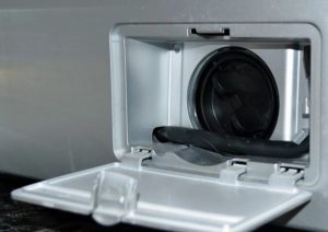 Where is the filter located in an LG washing machine?