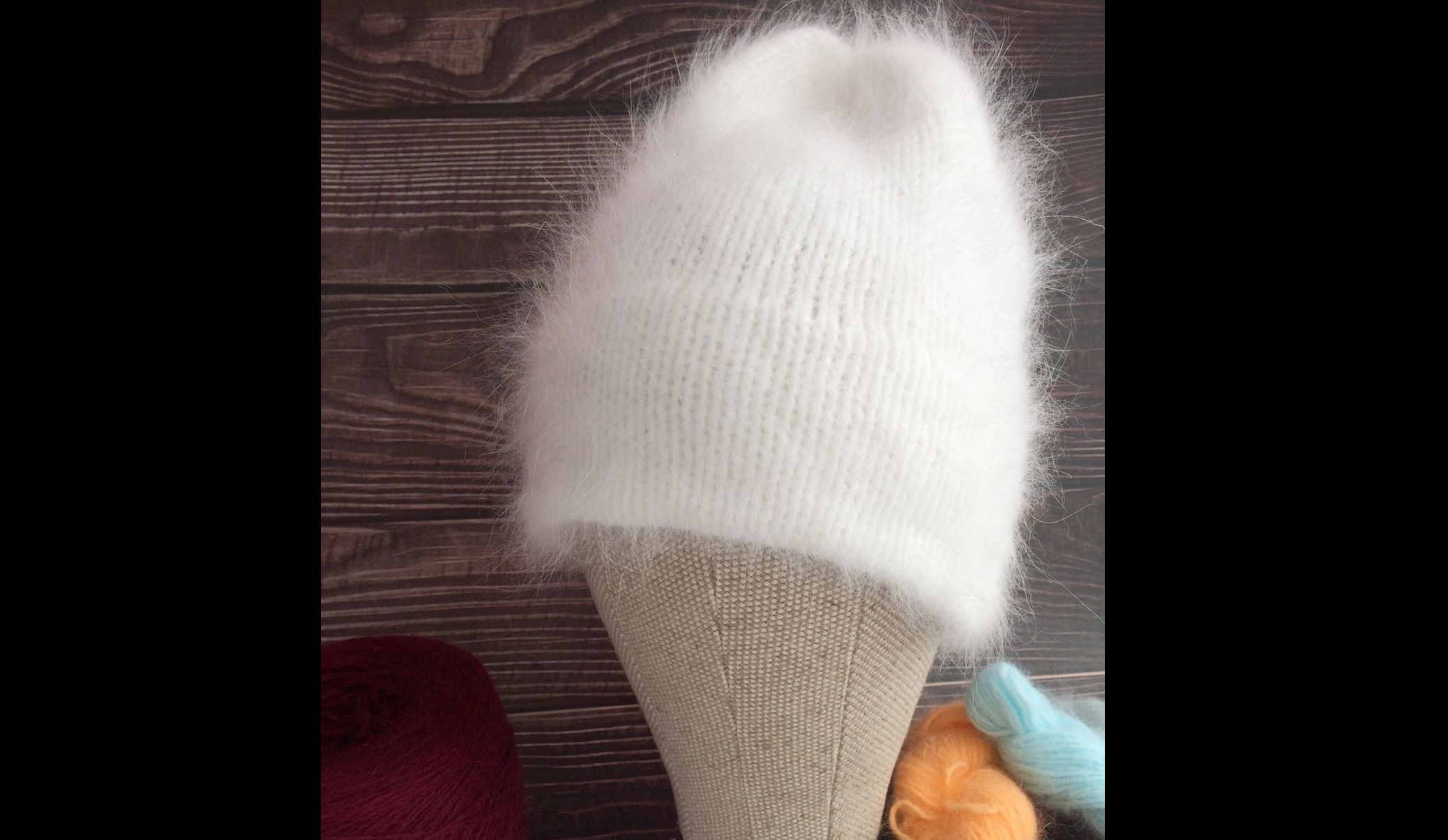 pull the angora hat onto the mold or jar