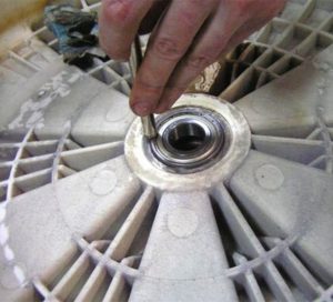 Pressing a bearing in a washing machine