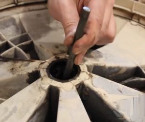 How to remove a stuck bearing from a washing machine drum?