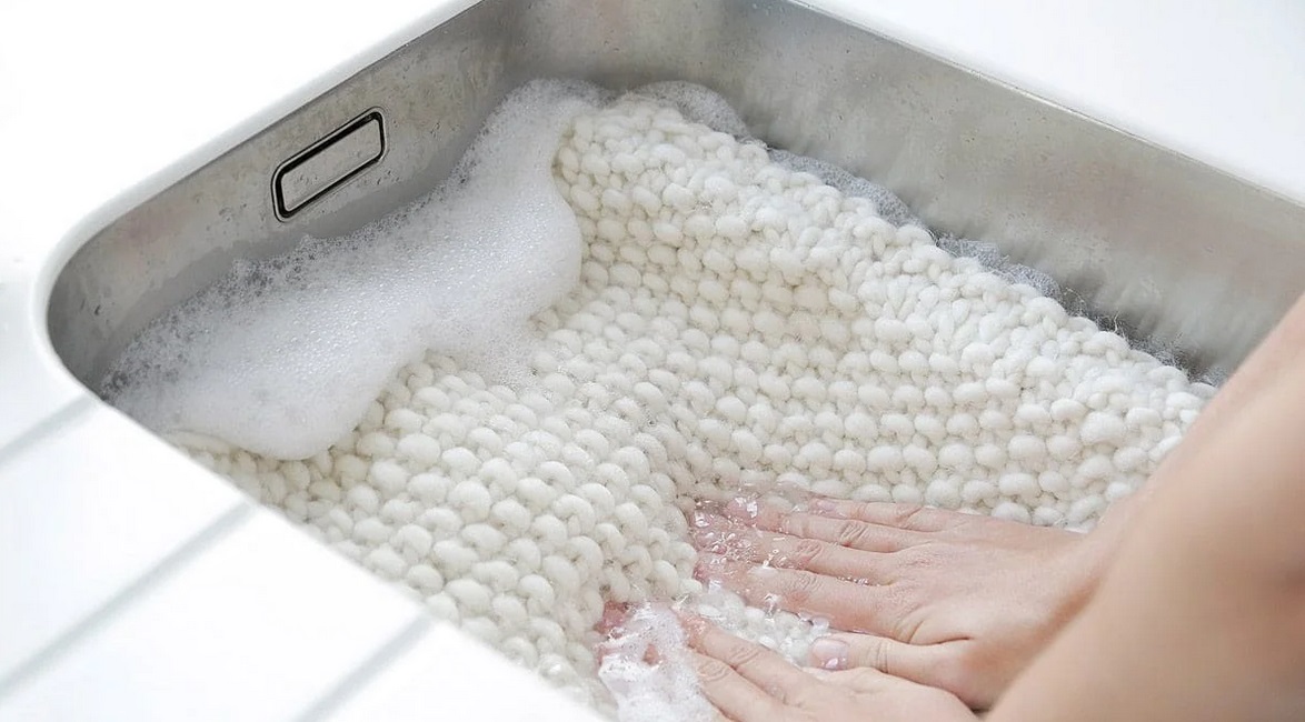 soak the cardigan in a container