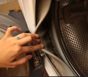 How to clean a washing machine from debris?