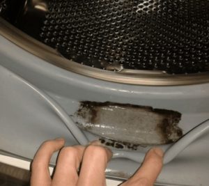 How to clean mold from a cuff in a washing machine?