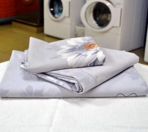 Poplin beddengoed wassen in een wasmachine