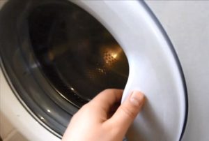 How to open the Kandy washing machine door if the handle is broken?