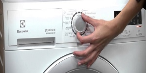 Turning on the Electrolux washing machine