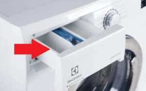 Where do you put the powder in an Electrolux washing machine?