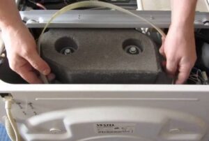 How to change the belt on a Vestel washing machine?