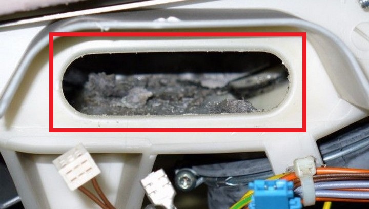 remove debris from the tank through the heating element seat