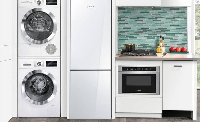 washing machine in a column in a small kitchen