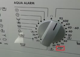 What does the iron sign on a washing machine mean?