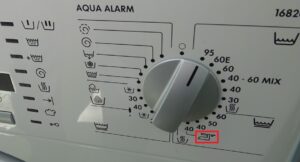 What does the iron symbol on a washing machine mean?