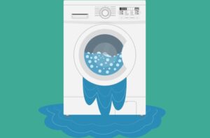 Why does my LG washing machine leak from the bottom during the spin cycle?