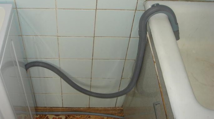 attach the drain hose to the bathtub and check the drainage