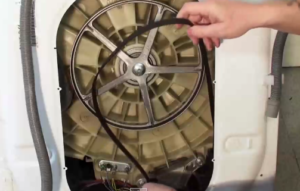 How to tighten the belt on an Indesit washing machine