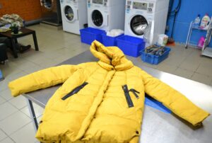 How to properly dry a down jacket after washing it in a washing machine?