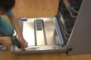 How to remove the door from a dishwasher