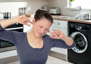 Why does my washing machine make a loud noise when rinsing?