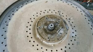 How to change the drum flange of a top-loading washing machine