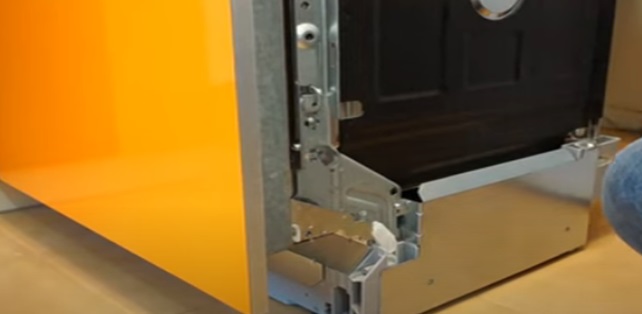 remove the decorative trim of the PMM door opening mechanism