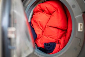 Do I need to turn my jacket inside out when washing it in the washing machine?