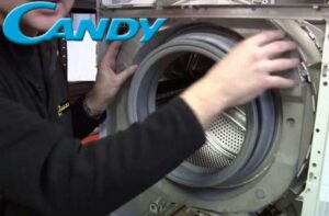 How to remove the front panel of a Candy washing machine