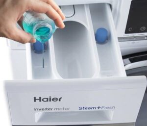 Où remplir le conditionneur dans une machine à laver Haier